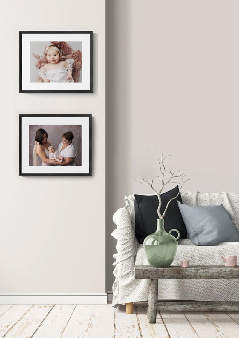 two black framed wall art photos displayed on a white wall designed in a murrysville studio