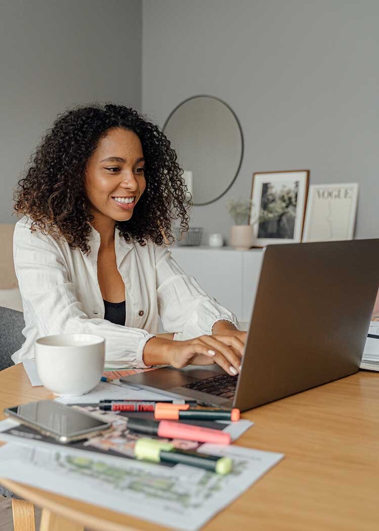 Woman Smiling over Computer
