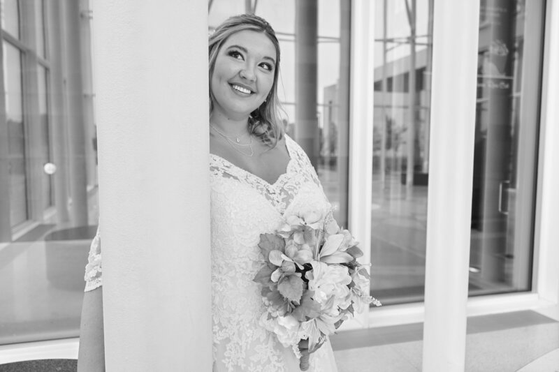 Captivating image of a radiant bride, smiling beautifully in her wedding dress, capturing a moment of pure joy and elegance.