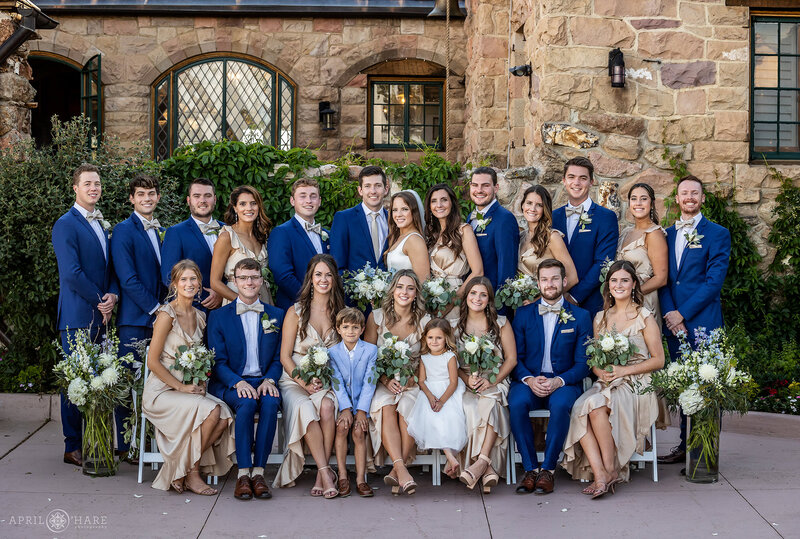Large Wedding Party Photo in the Courtyard at Cherokee Ranch & Castle in Colorado