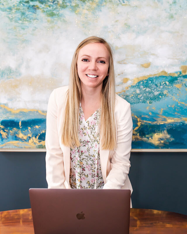 Marley Langford on her laptop consulting with a client