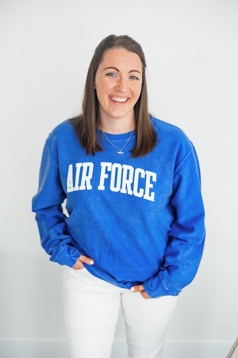 Erin Thompson laughing in an Air Force shirt