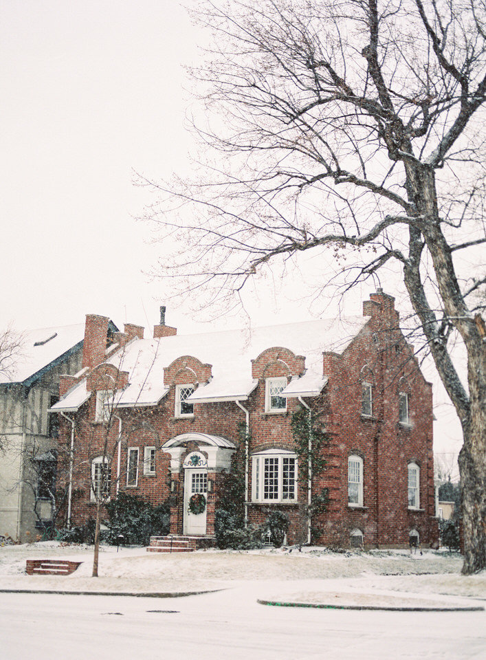 charming brick home covered in snow in denver