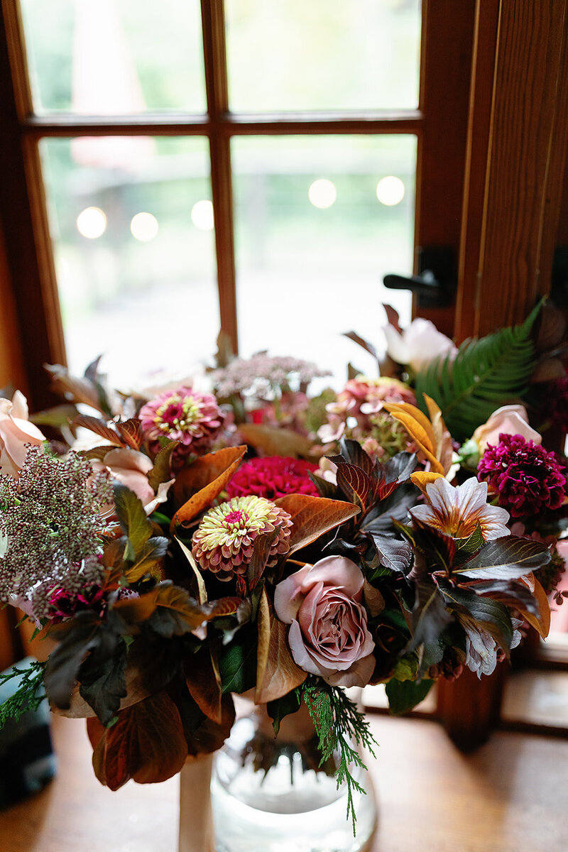 Close up of fall wedding bouquet in vase