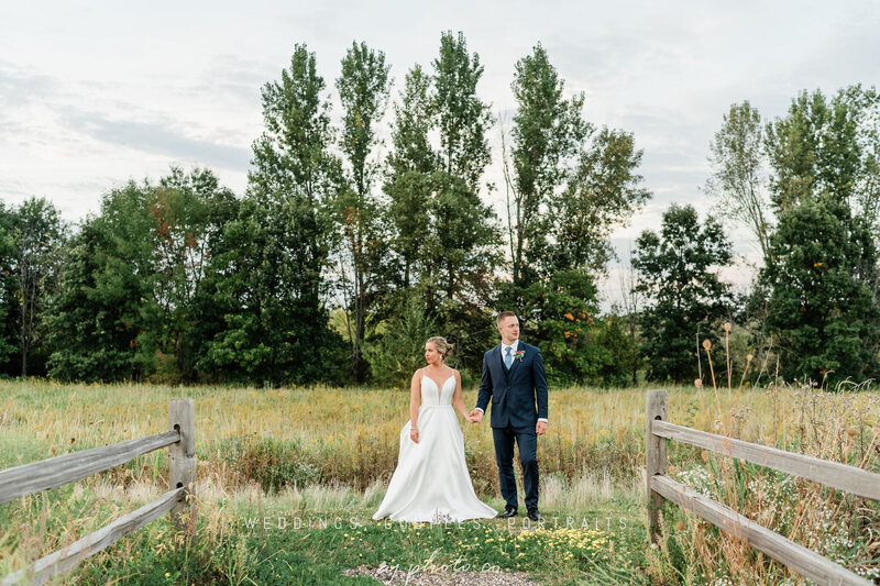 bride and groom in the field of barnwood events, a wedding venue in madison, winconsin.