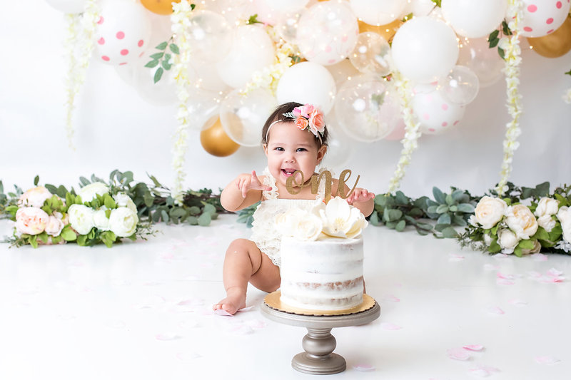 Baby girl eating cake