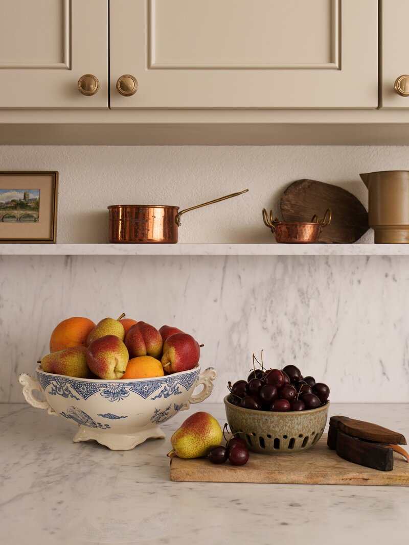 San Clemente beach home remodel. Marble countertop with marble ledge and creamy cabinets.