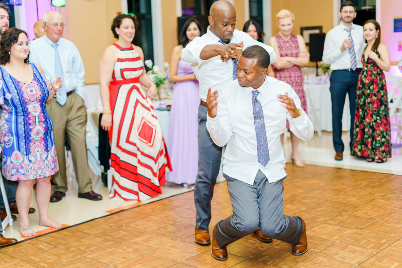 Groomsmen laughing and dancing at New Hampshire wedding