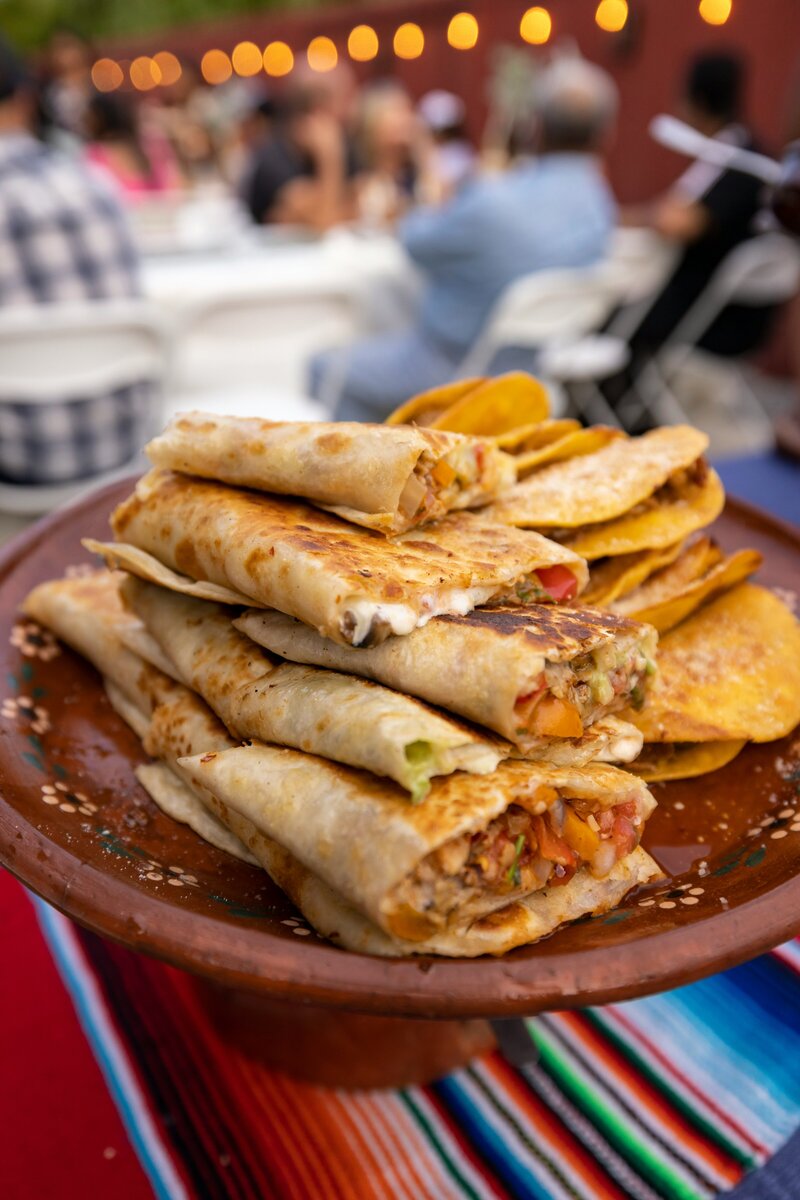 Hart and Main quincenera chicken and cheese quesadillas  with onion and cilantro garnish 