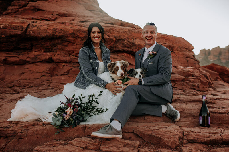 bride and groom with their dogs on their elopement day in arizona
