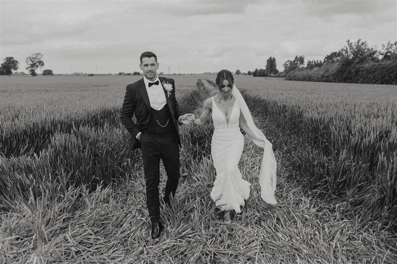 bride and groom in a wheat field at the riverlands east yorkshire wedding