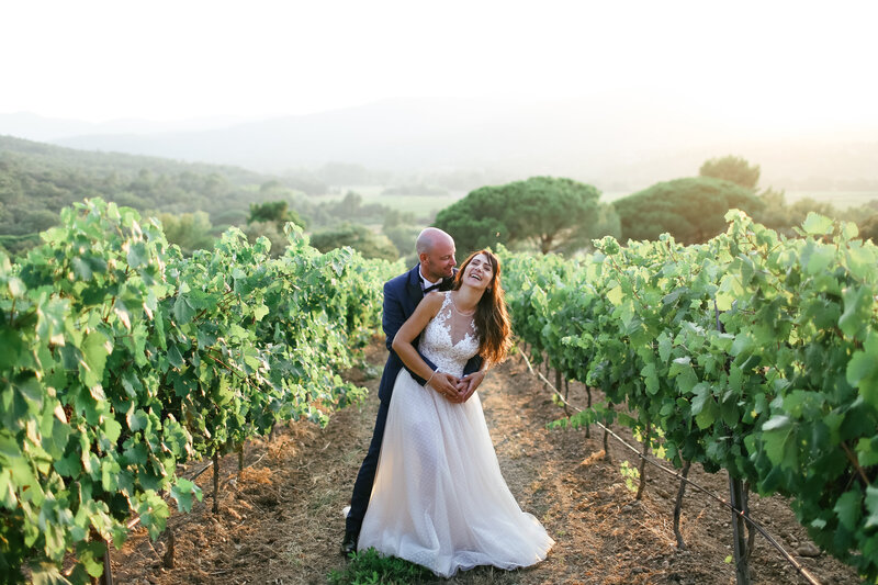 couple-laughing-together-in-vineyard-at-luxury-wedding-in-provence