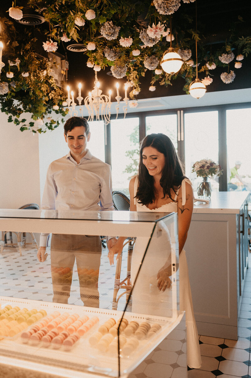 engagement photos of couple at bakery in Toronto