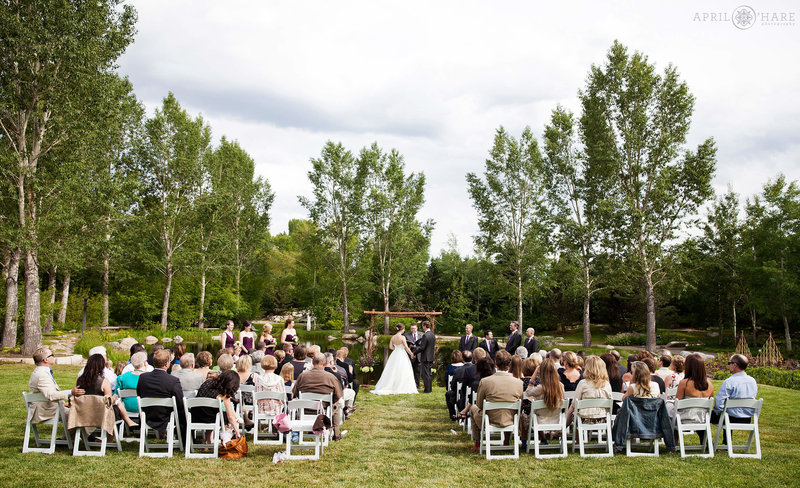 A pretty outdoor garden wedding in Steamboat Springs at the Yampa River Botanic Park