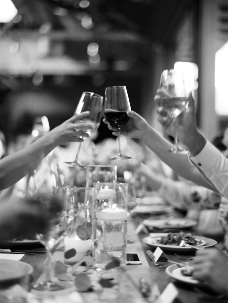 black and  white image of  glasses toasting