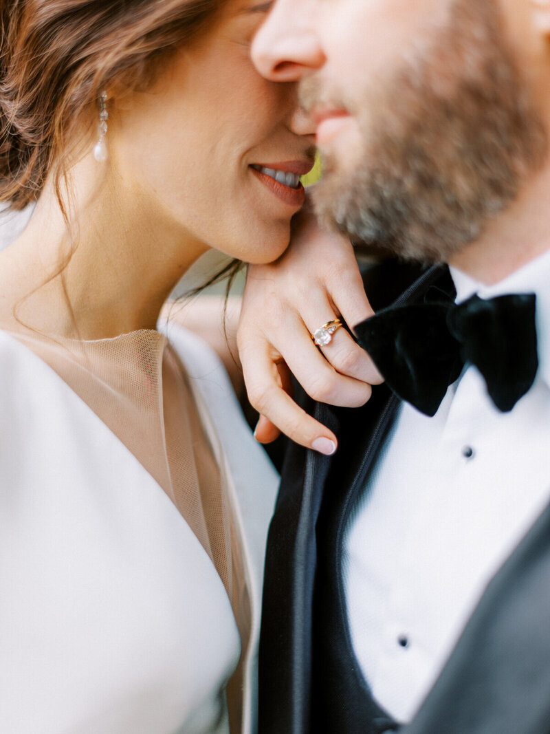 romantic close up of bride leaning on groom