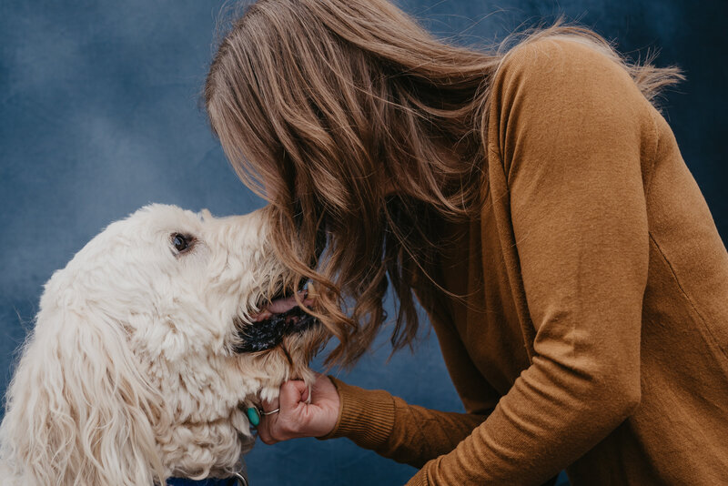 Beth Requist, custom web designer, Beth giving dog a kiss on the nose