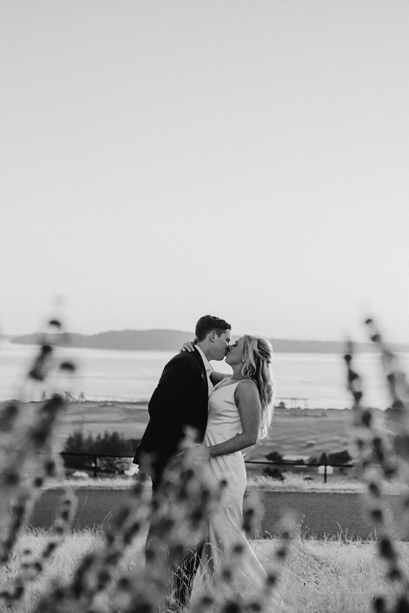 Couple Kissing with Bay View in the Background - Jessica & Chris | Golf Course Wedding Seattle Washington