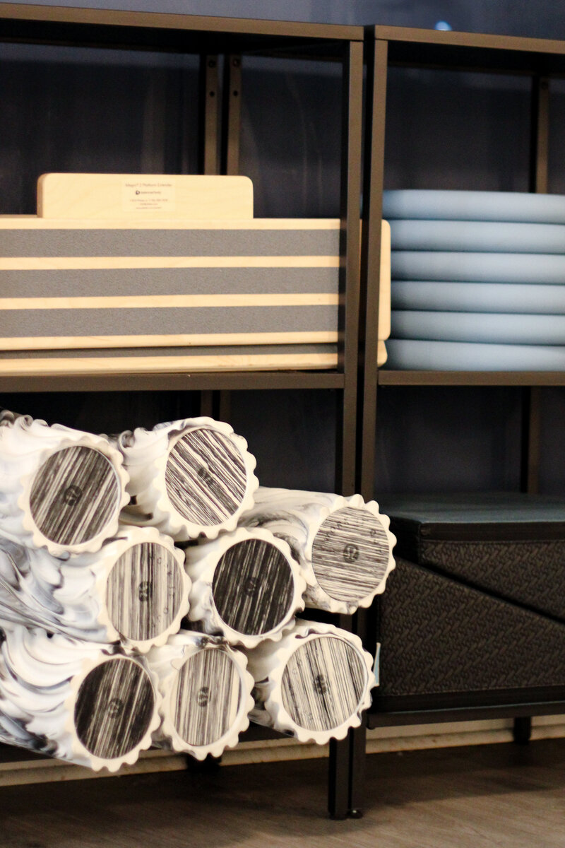Organized weights on shelf at TruFit Pilates strength studio