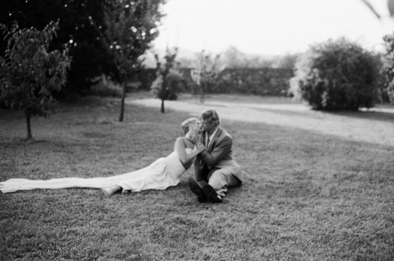 A heartfelt moment of a married couple standing together and sharing a loving kiss, showcasing their connection