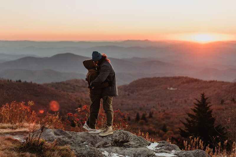Surprise proposal at sunrise on top of Black Balsam Knob in the Blue Ridge Mountains