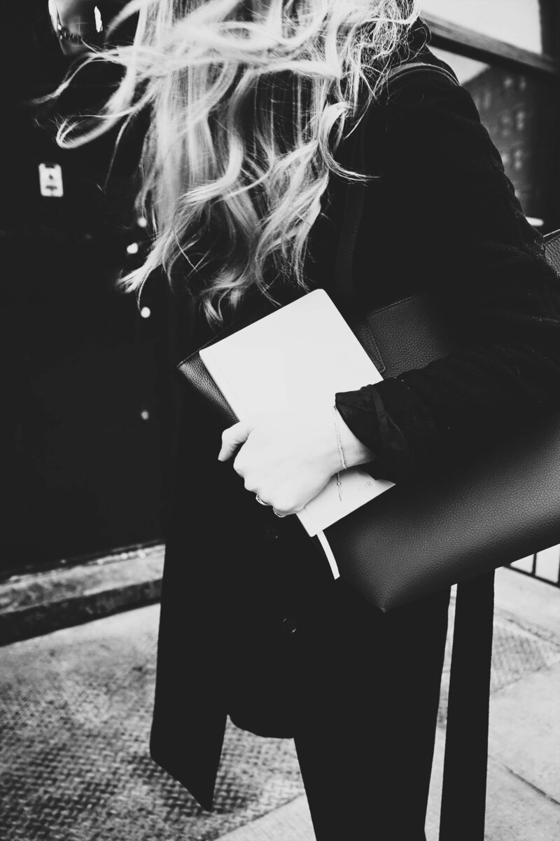 Business woman holding a notebook