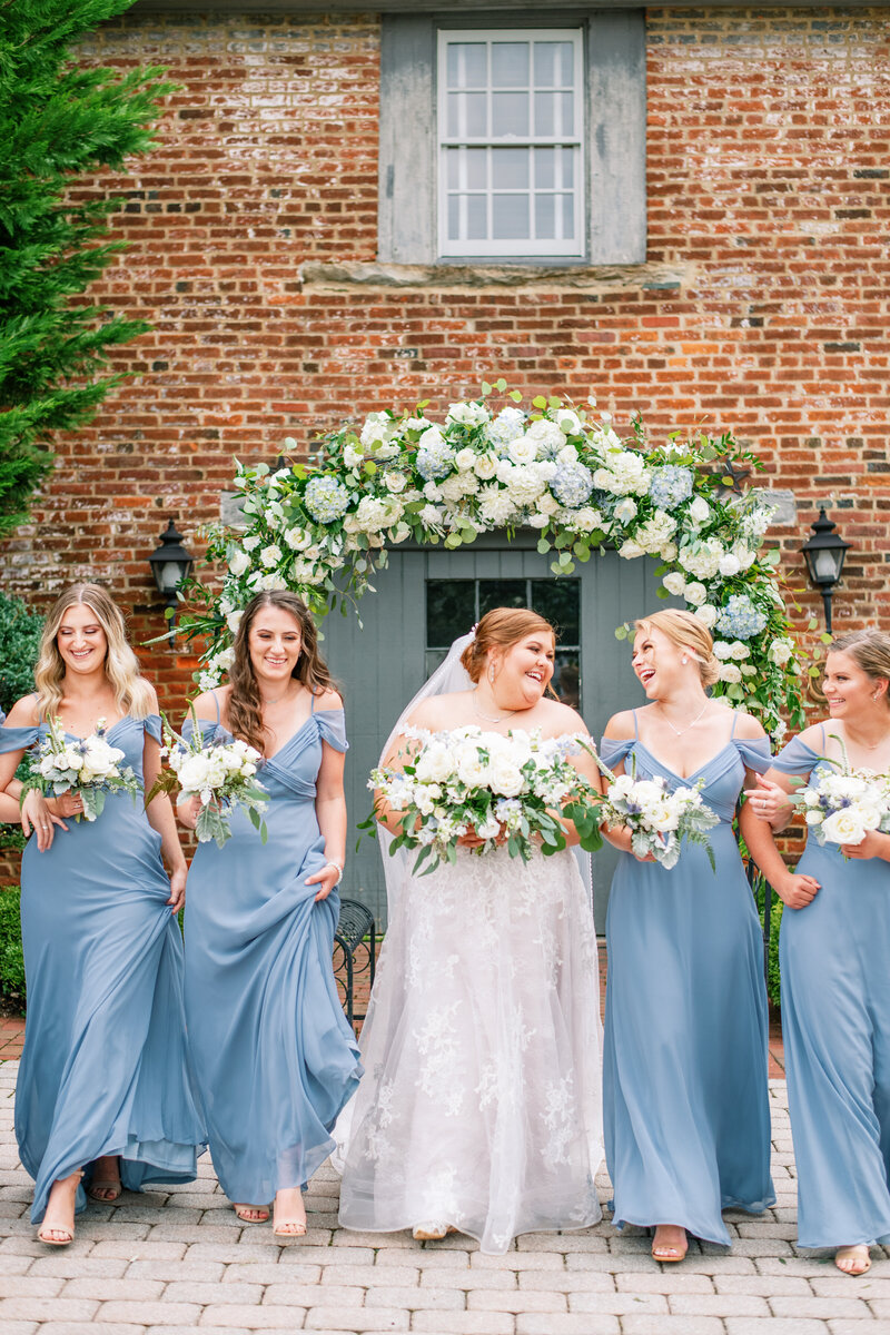 Bride and bridesmaids with blue and white bouquets in Leesburg, VA