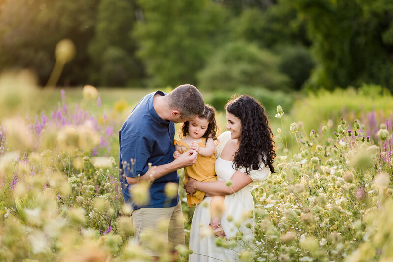 family embracing and playing during family photography session