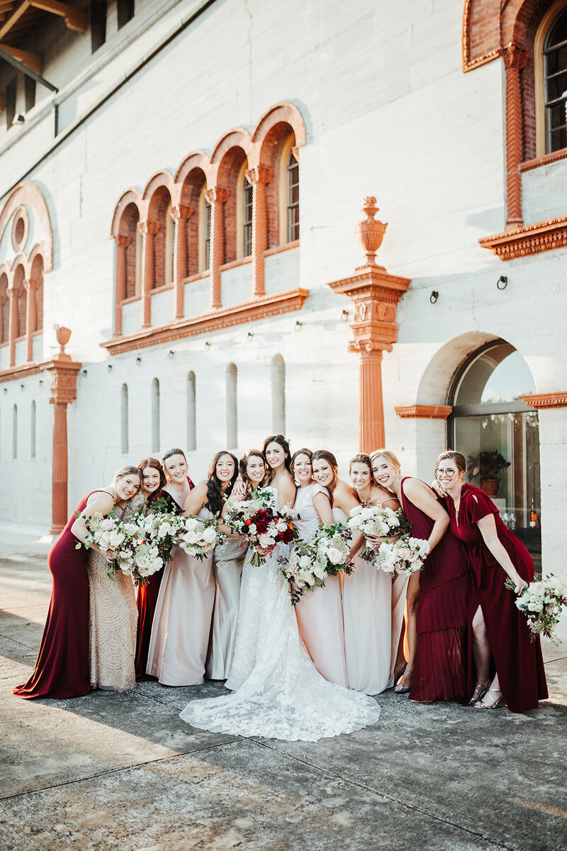 Bridesmaids in white and maroon