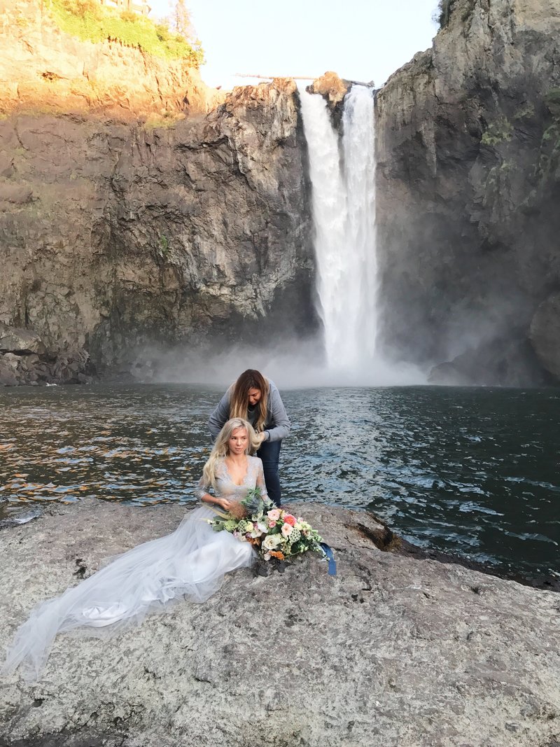 travel to a waterfall while doing makeup and hair