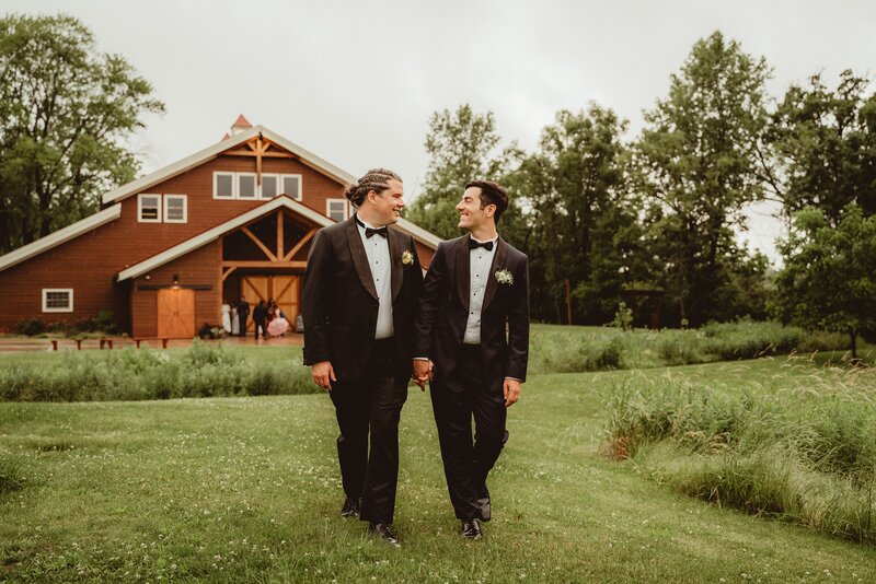 couple smiling at each other in the outdoor at barnwood events in madison, winconsin.