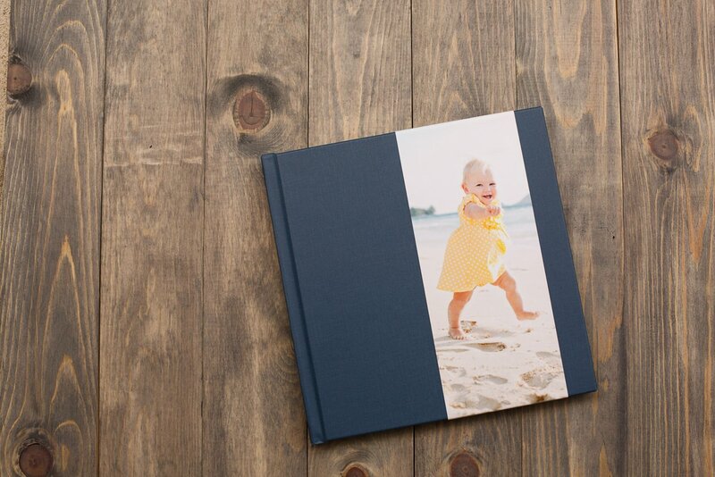 A photo album on a wood table