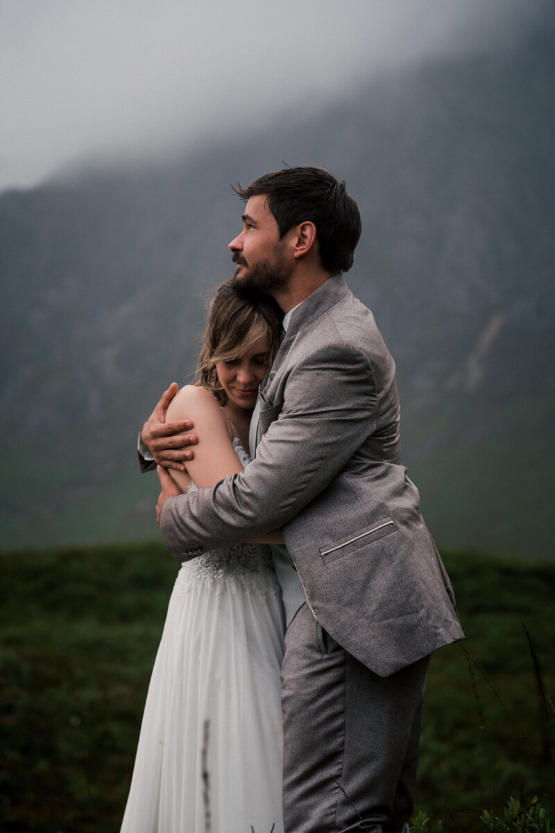Couple embrace during the Glencoe Elopement