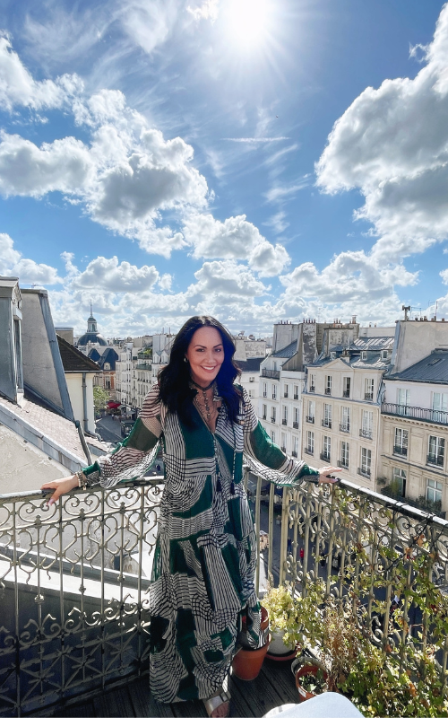 brunette woman on balcony in paris renee bowen photography