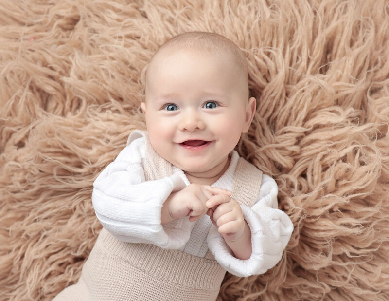 Sweet six month old posed at our Rochester, Ny studio.