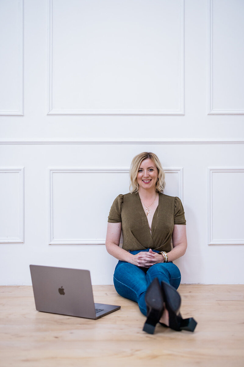 Nova Cobban, Psychologist specialising in generational divide at work sitting comfortably near laptop