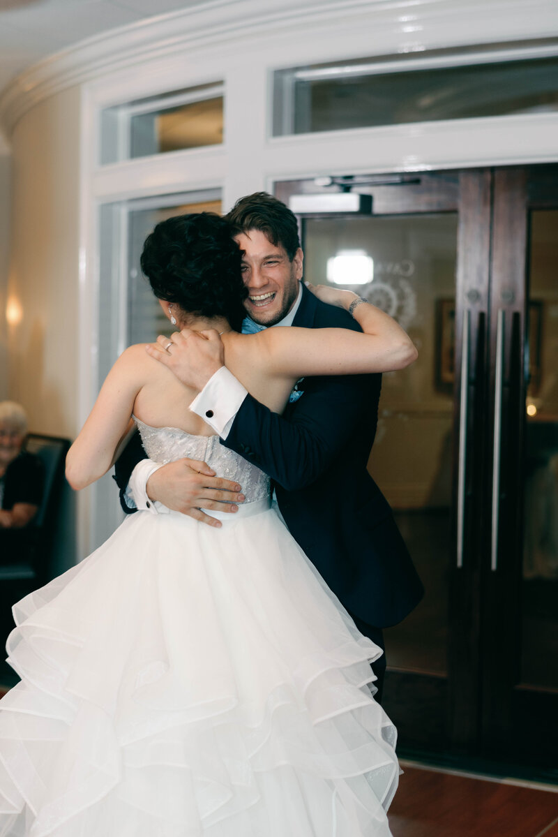 bride and groom hugging at their wedding reception in annapolis maryland