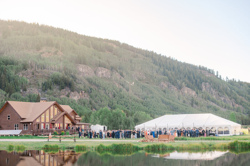 Wide view of a wedding reception at Camp Hale outside Vail, Colorado.