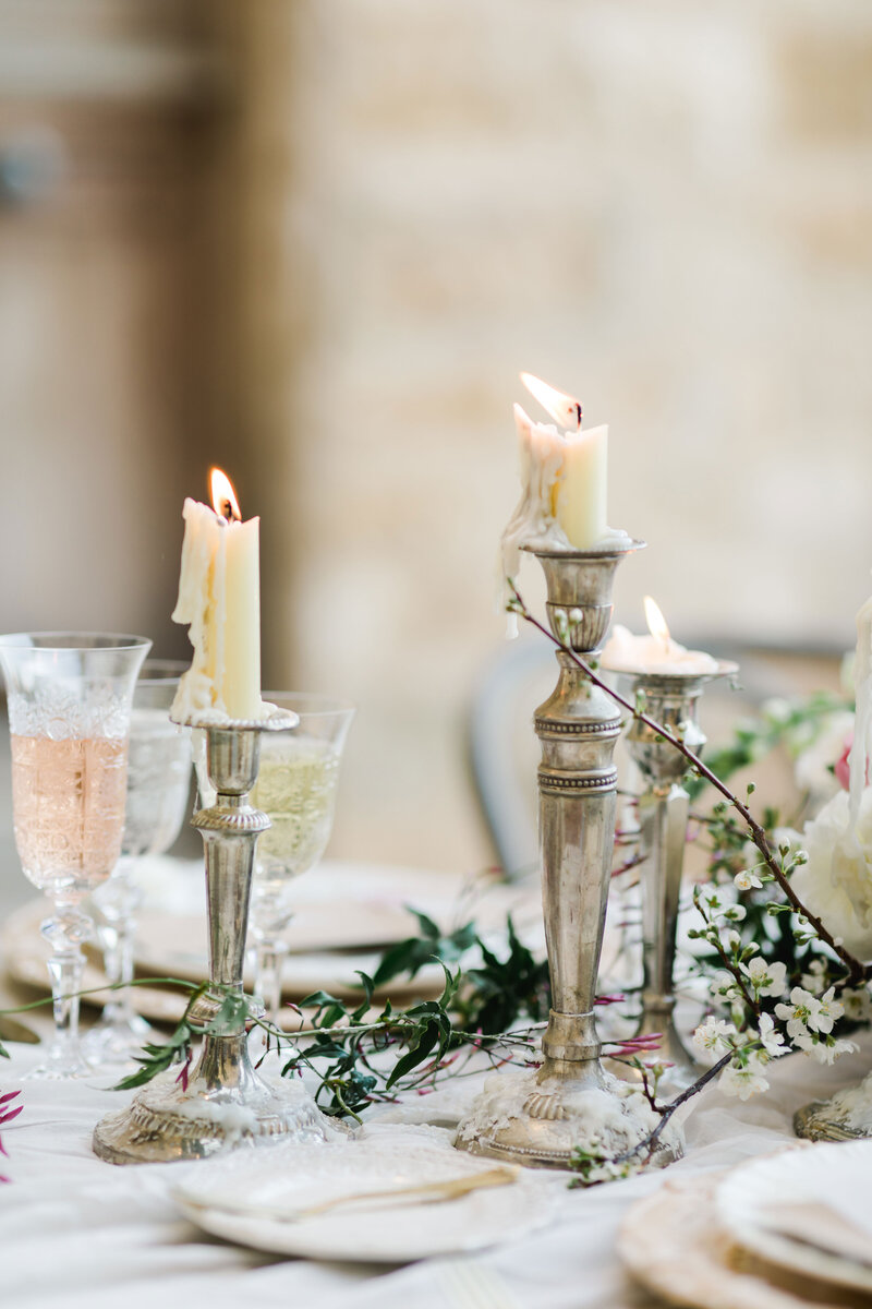Wedding reception tablescape with candles melting down