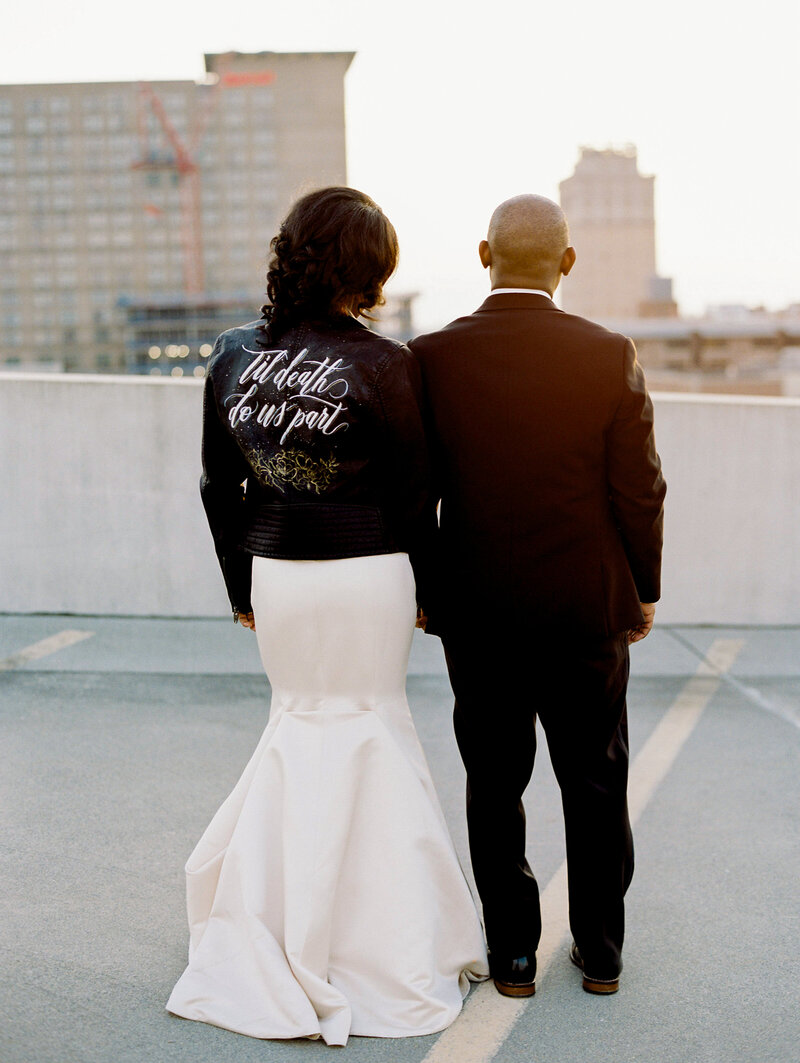 Bride and Groom on Rooftop with leather jacket