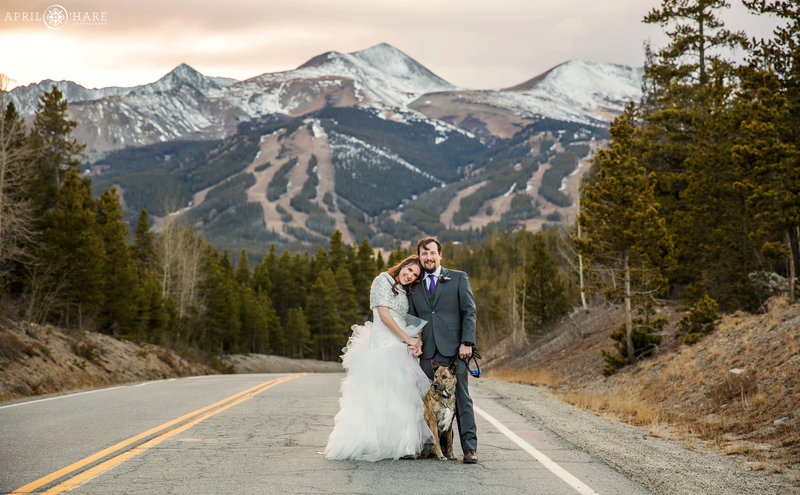 A pretty November wedding day for a couple posing in front of the ski slopes in Breckenridge