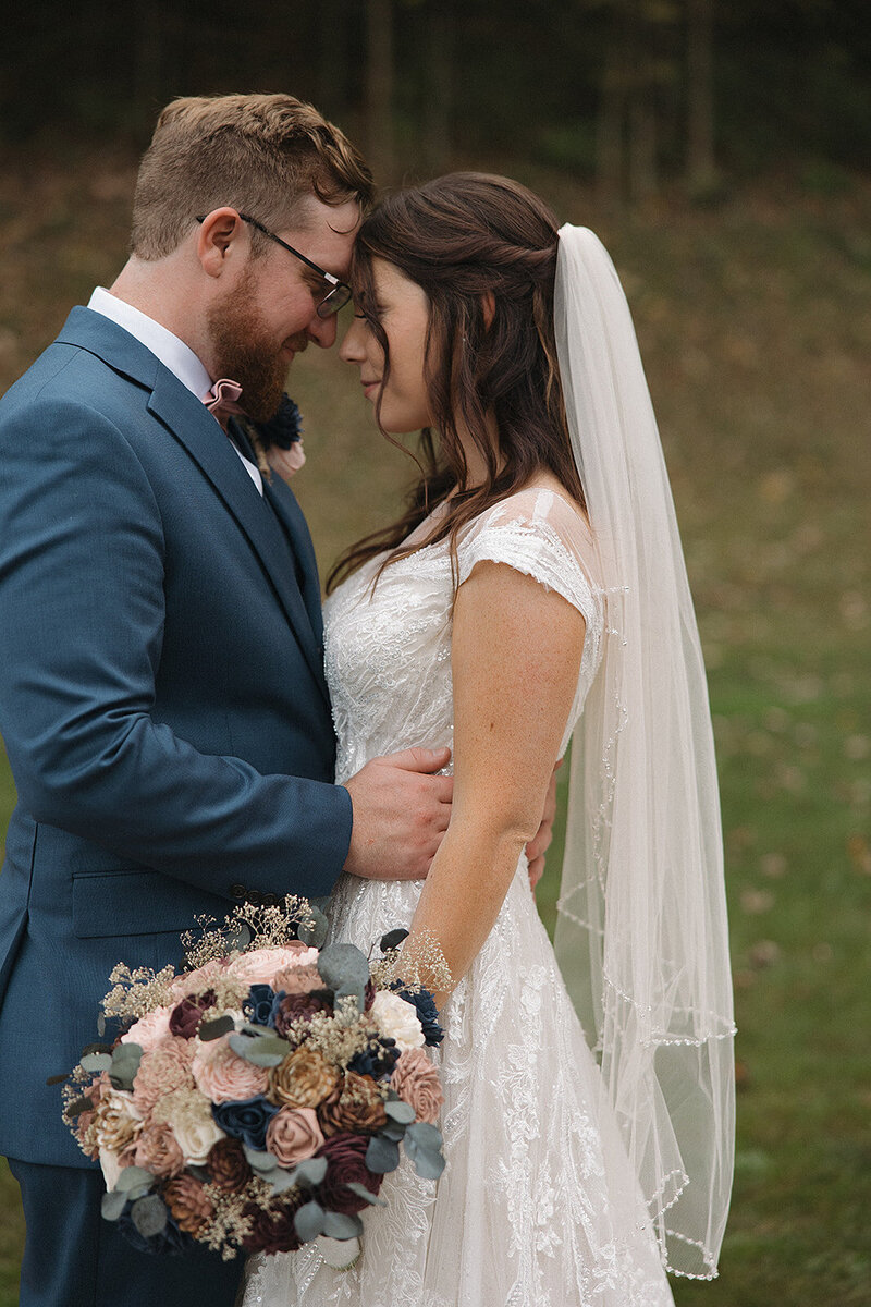 bride and groom embrace after wedding in lancaster pa