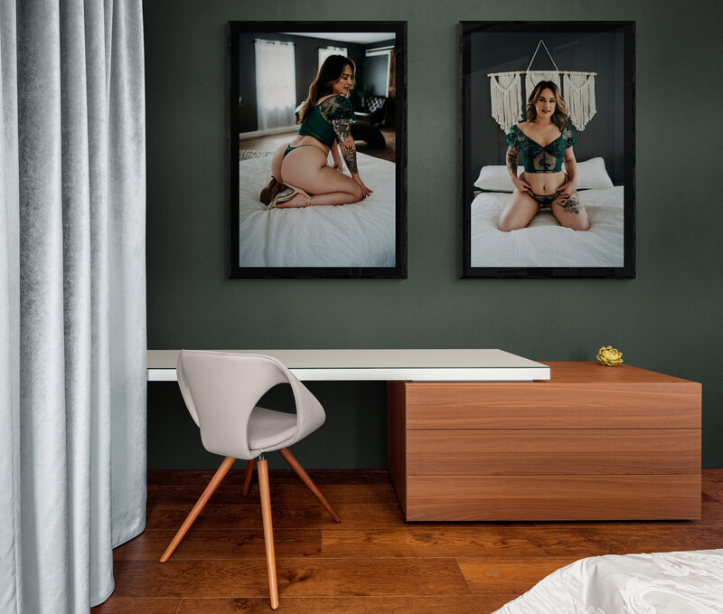 Image of an office with a desk and green wall with two framed luxury boudoir images