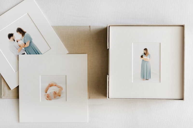 A matted print box of easily framable photos from a Newborn Photographer Washington DC photoshoot