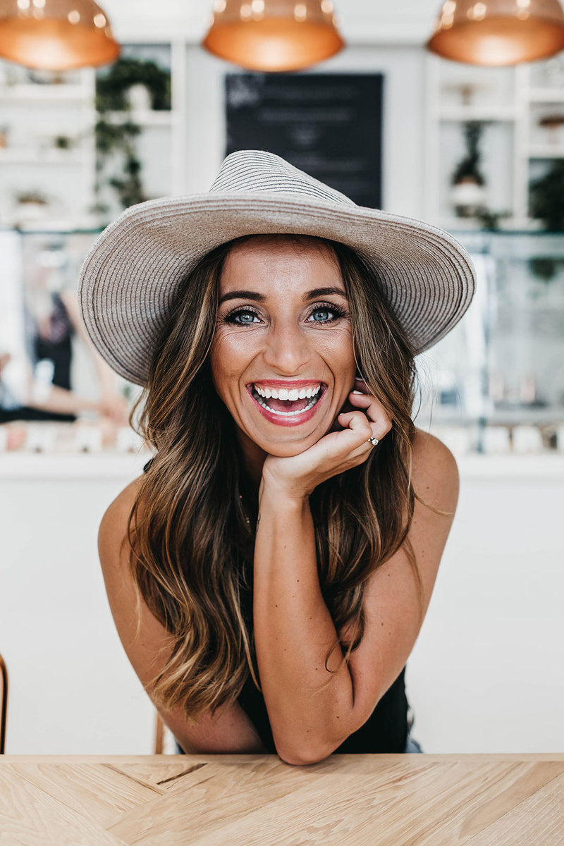 woman wearing hat while smiling