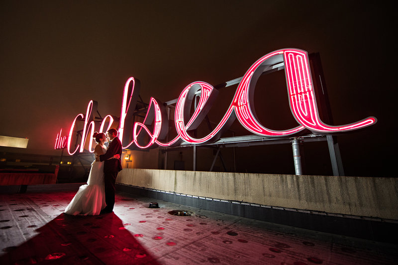 A bride and groom kiss on the roof of the chelsea hotel in atlantic city, nj.