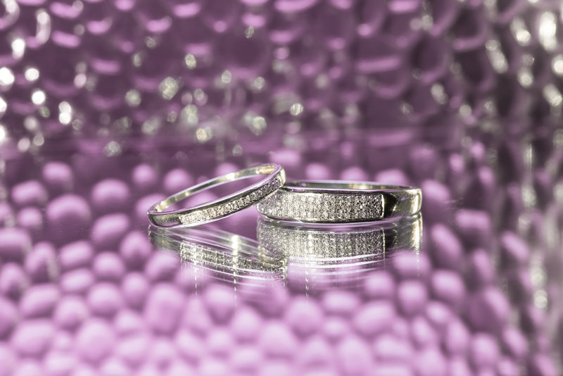 Diamond rings with light purple bokeh in background