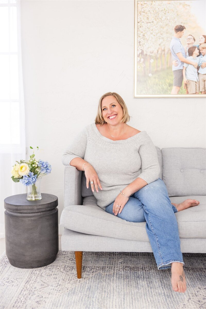 Best Boise, Idaho photographer Tiffany Hix sitting in her Boise portrait studio.