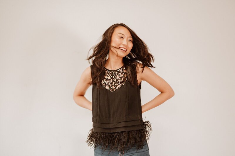 female in her mind thirties dressed up and having fun at a portrait session