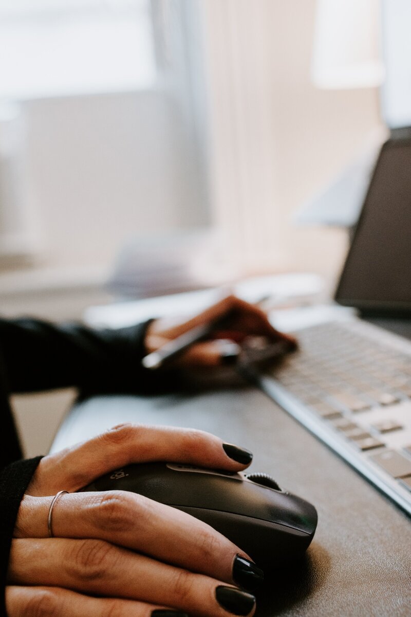 Photo of a laptop and work set up for a girl boss.